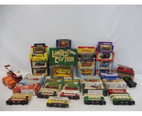 Two boxes of assorted die-cast models, including Corgi, trams, an original boxed Dinky fire engine etc.
