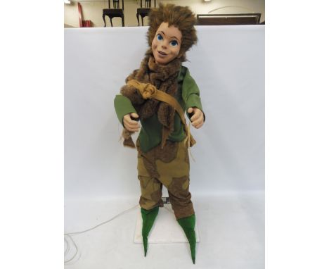 A shop window advertising automaton, figure of Peter Pan, by repute working.