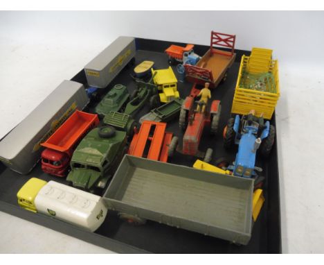 A selection of Britains and Corgi tractors, and others.