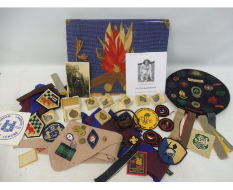 An interesting collection of guiding badges, some enamel, a guiding song book owned by J. Rutter who played for the ladies En