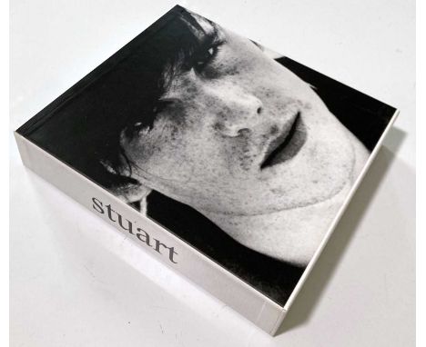 A copy of the Genesis title 'The Life and Art of Stuart Sutcliffe' numbered 236/2000 and signed by Pauline Sutcliffe, Kay Wil