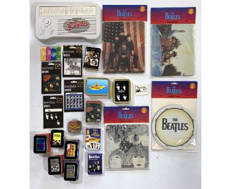 A collection of The Beatles collectables to include five Zippo lighters, four tobacco tins, a handheld mirror, two playing ca