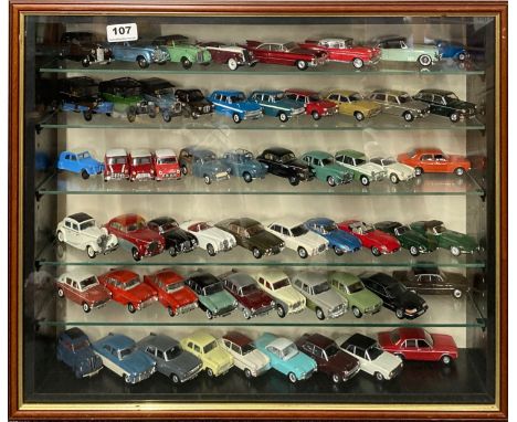 A display case containing diecast model vehicles, including Dinky and Vanguard, 52.5 x 63.5cm.