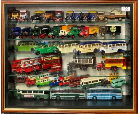 A display case containing diecast model vehicles, including Dinky, Yesteryear and Lledo, 52.5 x 63.5cm.