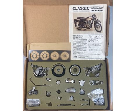 A metal assembly kit of a 1/9th scale model 1961 BSA DBD 34 Gold Star motorcycle by Classic Model Motorcycles. Appears to be 