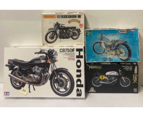 A boxed Tamiya Honda CB750F  1/6 scale (complete) together with three incomplete/part assembled motorcycle model kits.