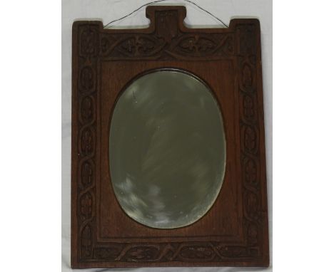 SMALL CARVED OAK MIRROR   