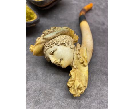 A Victorian clay pipe in the shape of a lady