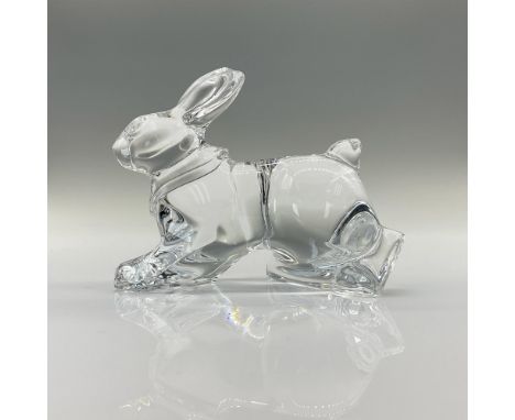 A clear crystal figure of a rabbit standing on all four paws prepared to scurry. Baccarat backstamp and signature. Dimensions