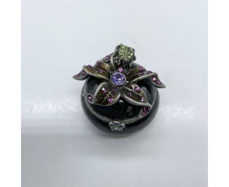 Beautiful trinket box decorated with enamel and colored crystals. Jay Strongwater stamp on the bottom. Dimensions: 1.25"dia. 