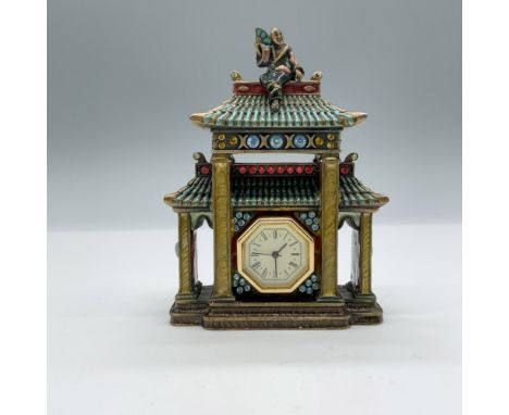 Beautiful mini pagoda clock with removable face. It is decorated with enamel and colored crystals. Jay Strongwater stamp on t
