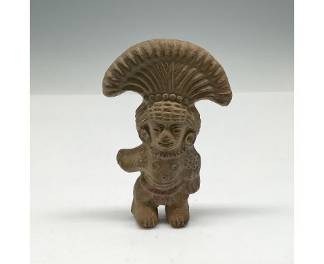 Carved clay statue with ceremonial headdress and body art. Issued: 20th centuryDimensions: 3"L x 0.75"W x 4.75"HCountry of Or