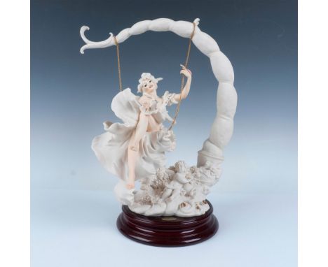 A limited-edition Giuseppe Armani Capodimonte porcelain figurine. Model Summertime. Depicts a female figure on a swing attach