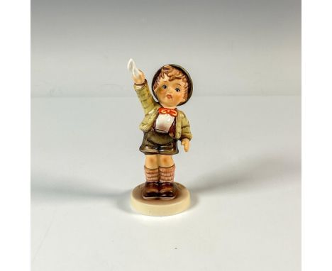 A small hand painted matte figure of a boy waving someone goodbye with his handkerchief. First Issue 1995. M.I. Hummel impres