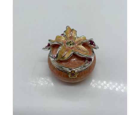 Beautiful trinket box decorated with enamel and colored crystals. Jay Strongwater stamp on the bottom. Dimensions: 1.25"dia. 