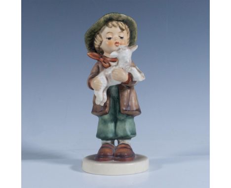 Matte finish. Depicts a little boy holding a sheep, dressed in green and red clothes. Goebel backstamp. Artist: M. I. HummelI