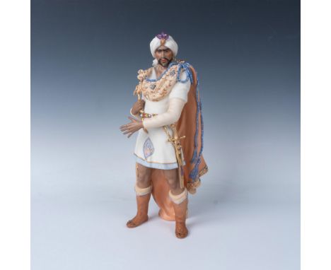 This porcelain figurine depicts the Shakespearian character, Othello. It has a matte finish with gilded accents and the Cybis