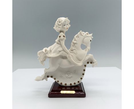 Fine crafted resin with white matte finish captures a young girl riding a detailed rocking horse. Marked made in Italy. Impre