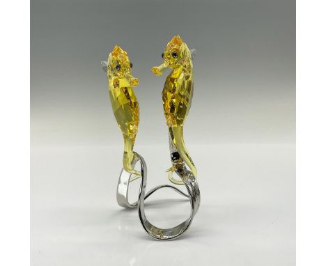 This endearing pair of seahorses sparkles in fully faceted Light Topaz Swarovski crystal. Their noses glow in Jonquil crystal