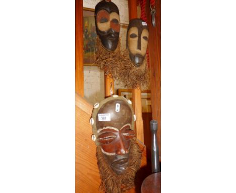 Tribal Art: Three carved and painted wood "Dan" masks