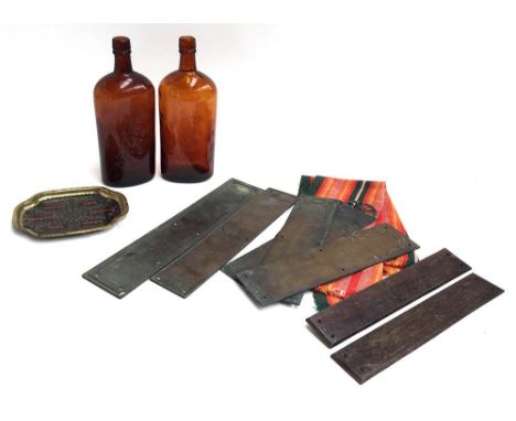 A mixed lot to include several brass door plates and two vintage bottles 