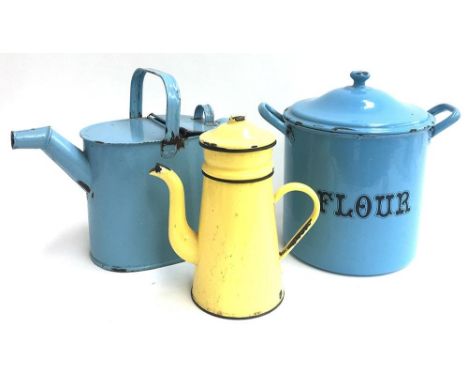 A vintage enamel flour bin, watering can, and coffee pot 