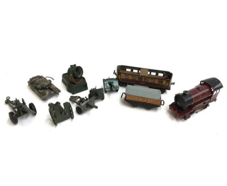 A Hornby 0 gauge 5800 engine with Pullman carriage; together with two Crescent Toy Company field guns, and three Britains fie