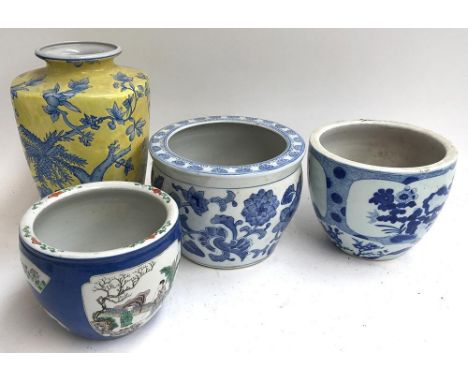 Three blue and white Chinese ceramic planters, together with a blue and yellow Chinese vase, 30cmH