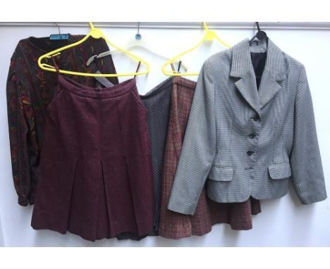 Two pink 1960s tweed skirts, together with a pleated nylon check skirt, dogtooth jacket, and silk blouse in paisley stripe pr