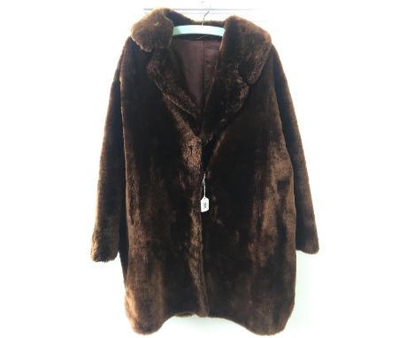 Very soft light weight brown mouton or beaver jacket with dark brown silk lining (size 10-12 approx) 