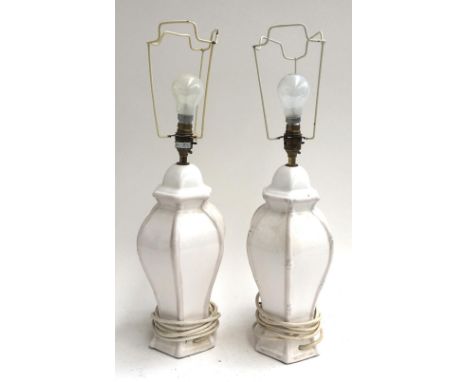 A pair of hexagonal white ceramic table lamps, each 34cmH 