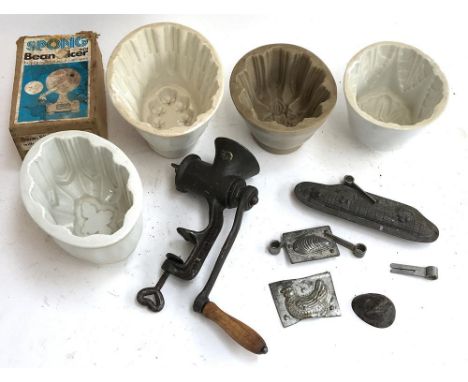 Four ceramic jelly moulds, together with two vintage metal chocolate moulds in the form of a shell and a submarine, two furth