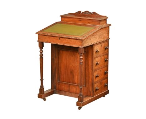 A late Victorian walnut Davenport desk, with rear stationery compartments, tooled leather writing surface and open interior w