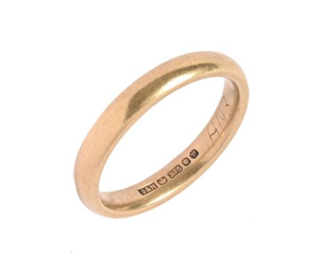 A 9 ct gold band.  Size K, weight 2.7 grams.