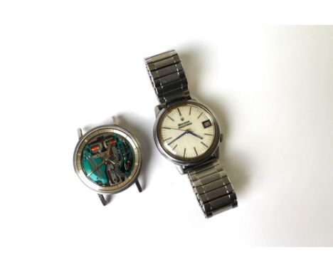 A Bulova Accutron stainless steel wristwatch, with date.  Case diameter 34 mm and another with visible movement also by Bulov