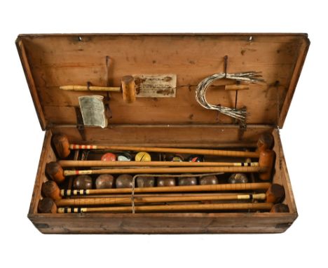 A late Victorian boxed croquet set by F H Ayres, instruction booklet dated 1895, eight mallets, eight large balls, five small