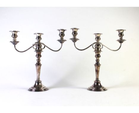 A large pair of silver plated candelabra, height +/- 42 cm.