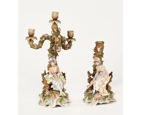 A 19th century German porcelain three branch candelabra, with female figural floral encrusted base and with further base lack