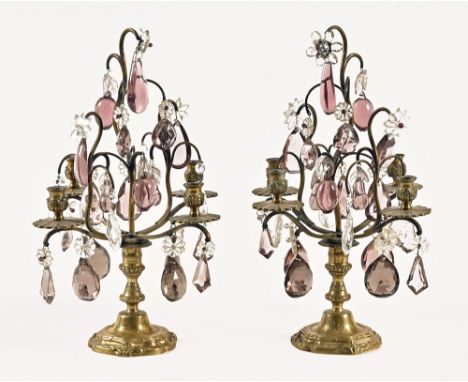 A pair of four branch candelabra, with glass lustre drops.  Height 40 cm.
