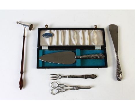 A London silver candle snuffer 1968, a white metal handled fork and shoehorn, an electro plated vine scissors and a cased She