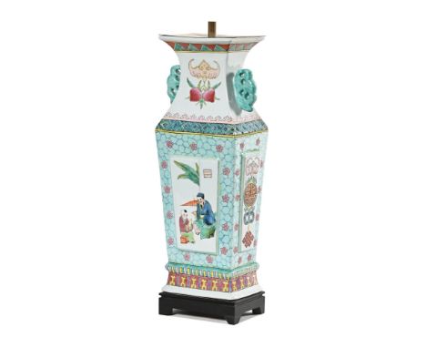 A Cantonese style decorative lamp base, of rectangular form with decorative panels raised on a wood base.  Height 54 cm, widt