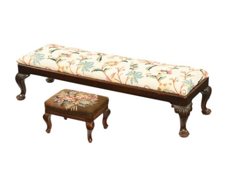 A Queen Anne style mahogany hearth footstool, mahogany with cabriole legs terminating in pad feet.  Height 29 cm, length 116 