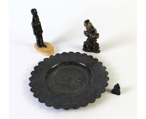 A Chinese bronze dish, a soapstone figure, a Buddha figure and an Egyptian statue raised on an oval marble plinth.  Dish diam