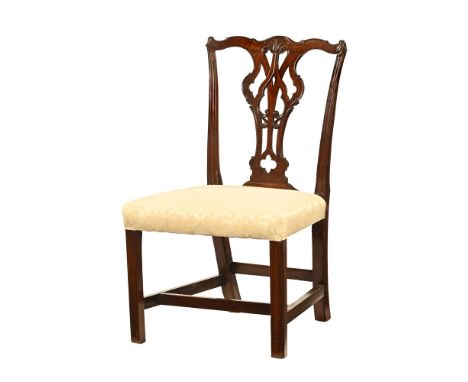 A George III mahogany Chippendale style splat back occasional chair, with carved yoke shaped top rail, pierced splat back and