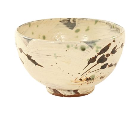 Jim Malone (born 1946), a studio pottery bowl, decorated with a white brushed glaze and floral sprigs, with impressed J M and