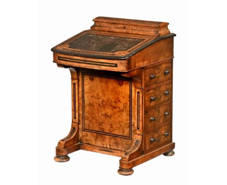 A Victorian walnut Davenport desk, with rear stationery compartment, being boxwood and ebony strung and raised on bun feet.  