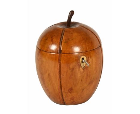 A tea caddy, in the form of a fruit with bone lock escutcheon, height +/- 15 cm.