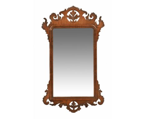 A 19th century mahogany Chippendale style fret carved wall mirror, with moulded slip.  Height 79 cm, width 46 cm (see illustr