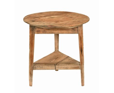 A Victorian pine cricket table, circular with low shelf.  Height 70 cm, diameter 70 cm.   CONDITION REPORT:  The table is str