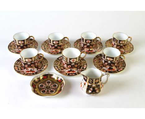 A Royal Crown Derby Imari patterned tea or coffee set, comprising 7 cups, 7 saucers and a cream jug, together with a later sm